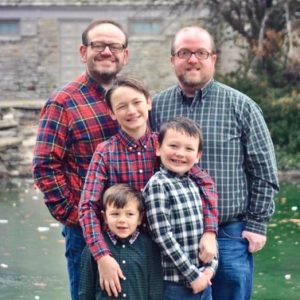 A family of boys posing for a picture