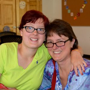 Two people hugging and smiling for a picture