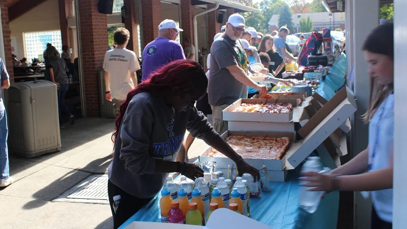 lunch People in line to get pizza and food at an event