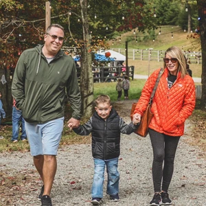 Mom and dad walking with their child